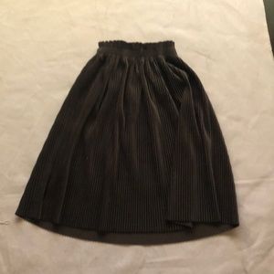 Dark green, a little above knee length, stretchy